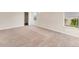 Bright and airy bedroom features plush carpet, base trim, and large windows for abundant natural light at 4307 70Th E Ave, Ellenton, FL 34222