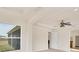 Bright bedroom with a ceiling fan, large window with a view, and an ensuite bathroom at 4307 70Th E Ave, Ellenton, FL 34222
