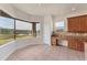 Tile-floored breakfast nook features cabinet storage and large bay window, plus views of the pond at 4307 70Th E Ave, Ellenton, FL 34222