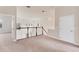 Upstairs hallway features new carpet, white railing, and lots of natural light from windows overlooking the living area at 4307 70Th E Ave, Ellenton, FL 34222