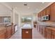 Bright kitchen with a large island, stainless steel appliances, ample counter space, and an attractive view at 4307 70Th E Ave, Ellenton, FL 34222