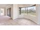 Bright living space featuring tile flooring, large windows offering scenic views, and sliding door access at 4307 70Th E Ave, Ellenton, FL 34222