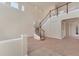 Expansive living room featuring a winding staircase and neutral-toned carpet at 4307 70Th E Ave, Ellenton, FL 34222