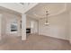 Open-concept living space with a fireplace, columns, and ample natural light at 4307 70Th E Ave, Ellenton, FL 34222