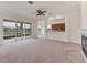 Bright living area with scenic views, neutral carpet, sliding glass doors, and an open layout at 4307 70Th E Ave, Ellenton, FL 34222