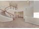 Spacious living area with high ceilings, a winding staircase, and views into other rooms at 4307 70Th E Ave, Ellenton, FL 34222