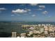 Expansive aerial view showcasing the bay, city skyline, and numerous sailboats at 435 L Ambiance Dr # L807, Longboat Key, FL 34228