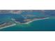 Beautiful aerial view of the waterfront property and beach access at 435 L Ambiance Dr # L807, Longboat Key, FL 34228