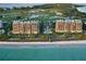 Beautiful beachfront condos with a pool, lush landscaping, and direct beach access at 435 L Ambiance Dr # L807, Longboat Key, FL 34228