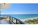 Enjoy breathtaking ocean views from this condo's spacious balcony with glass railings at 435 L Ambiance Dr # L807, Longboat Key, FL 34228