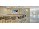 Entertain in style at this bar featuring counter seating, stone counters, and a beach view television at 435 L Ambiance Dr # L807, Longboat Key, FL 34228