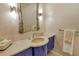 Bathroom featuring a unique mirror with stylish vanity, marble countertop, vessel sink, and modern lighting at 435 L Ambiance Dr # L807, Longboat Key, FL 34228