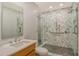 Modern bathroom boasts dual vanities, and a frameless marble shower at 435 L Ambiance Dr # L807, Longboat Key, FL 34228