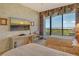 Bright bedroom with two twin beds, floor to ceiling windows, and a beautiful view of the gulf at 435 L Ambiance Dr # L807, Longboat Key, FL 34228