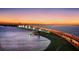 Waterfront bridge view, illuminated at dusk with surrounding waterways and city lights at 435 L Ambiance Dr # L807, Longboat Key, FL 34228