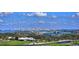 Panoramic cityscape view over a lush green golf course, with a waterway and bridge at 435 L Ambiance Dr # L807, Longboat Key, FL 34228