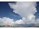 Expansive cloudscape over a coastal city and calm ocean waters at 435 L Ambiance Dr # L807, Longboat Key, FL 34228