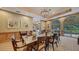 Enjoy the dining room with large windows and wood accents at 435 L Ambiance Dr # L807, Longboat Key, FL 34228