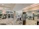 Modern gym with treadmills, exercise bikes, weights, mirrors, ceiling fans, and other equipment at 435 L Ambiance Dr # L807, Longboat Key, FL 34228