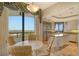 Bright eat-in kitchen features floor to ceiling windows, stainless steel appliances, granite counters, and beautiful golf course views at 435 L Ambiance Dr # L807, Longboat Key, FL 34228
