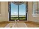 Granite countertops and a scenic view from the kitchen window overlooking the city at 435 L Ambiance Dr # L807, Longboat Key, FL 34228