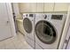 Bright laundry room features modern LG washer and dryer at 435 L Ambiance Dr # L807, Longboat Key, FL 34228