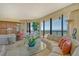 The living room has floor to ceiling windows that let in plenty of natural light and ocean views at 435 L Ambiance Dr # L807, Longboat Key, FL 34228
