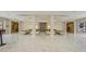Spacious lobby with sleek furnishings and elegant marble floors at 435 L Ambiance Dr # L807, Longboat Key, FL 34228