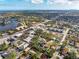 Aerial view showcasing the community, nearby shopping, and lake at 445 88Th N Ave, St Petersburg, FL 33702