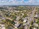 Aerial view of neighborhood with mature trees and beautiful sky at 445 88Th N Ave, St Petersburg, FL 33702