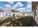Fenced backyard with lawn and a storage shed at 445 88Th N Ave, St Petersburg, FL 33702