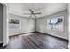 Bedroom with wood-look flooring and natural light from two windows at 445 88Th N Ave, St Petersburg, FL 33702