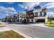 Modern townhome featuring a rooftop deck with spiral staircase, ground-level garage, and contemporary design at 445 88Th N Ave, St Petersburg, FL 33702