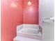 Relaxing bathroom featuring a soaking tub with marble-like tile surround and attractive wall color at 4920 82Nd E Pl, Sarasota, FL 34243
