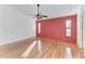 Spacious bedroom with light wood floors and windows allowing plenty of natural light at 4920 82Nd E Pl, Sarasota, FL 34243