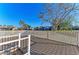 Wooden deck with white railings providing scenic views of the surrounding neighborhood at 4920 82Nd E Pl, Sarasota, FL 34243