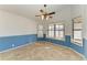 Bright dining room featuring tile floors, a ceiling fan, and many windows with natural light at 4920 82Nd E Pl, Sarasota, FL 34243