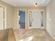 Bright foyer with tiled floor and view into a large living space at 4920 82Nd E Pl, Sarasota, FL 34243