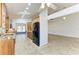 Open kitchen featuring wood cabinetry, granite countertops, stainless steel appliances, and natural light at 4920 82Nd E Pl, Sarasota, FL 34243