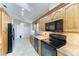 Spacious kitchen with stainless steel appliances, granite counters and wooden cabinets at 4920 82Nd E Pl, Sarasota, FL 34243