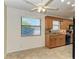Open kitchen featuring wood cabinetry, granite countertops, and stainless steel appliances at 4920 82Nd E Pl, Sarasota, FL 34243