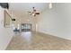 Open-concept living room with sliding glass doors leading to an outdoor space at 4920 82Nd E Pl, Sarasota, FL 34243