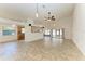 Spacious living room with tile flooring, ceiling fans, and ample natural light at 4920 82Nd E Pl, Sarasota, FL 34243