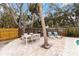 Spacious backyard patio with dining and lounging area at 5107 Saint Albans Ave, Sarasota, FL 34242