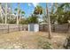 Backyard with storage shed and wooden fence at 5107 Saint Albans Ave, Sarasota, FL 34242