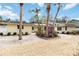 Charming home with a well-maintained exterior, tropical landscaping, and a gravel driveway at 5107 Saint Albans Ave, Sarasota, FL 34242