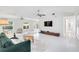 Spacious living room with modern decor, sleek furniture, and view of the outdoor pool at 5107 Saint Albans Ave, Sarasota, FL 34242