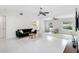 Bright living room with contemporary decor, neutral tones, and view of the outdoor pool at 5107 Saint Albans Ave, Sarasota, FL 34242