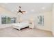 Bright main bedroom with ceiling fan, recessed lighting and large windows with shades at 5107 Saint Albans Ave, Sarasota, FL 34242