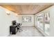 Home office with wood ceiling, tile floor and large windows with outside view at 5107 Saint Albans Ave, Sarasota, FL 34242